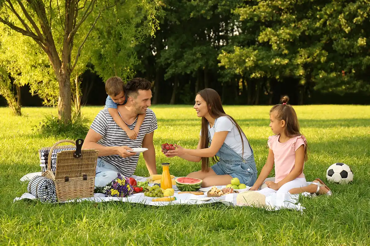 Get the kids interested in a picnic, come up with games and organize a delicious meal