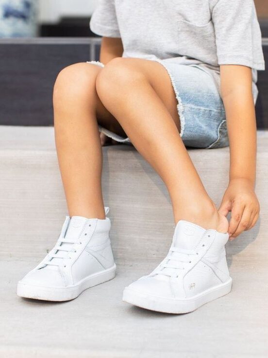 selection of children's white sneakers